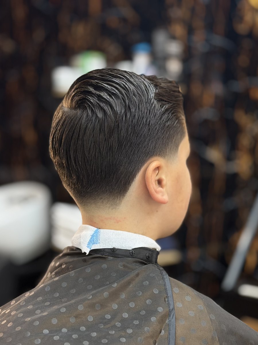Taper fade met slick back bij Old City Barbershop Helmond